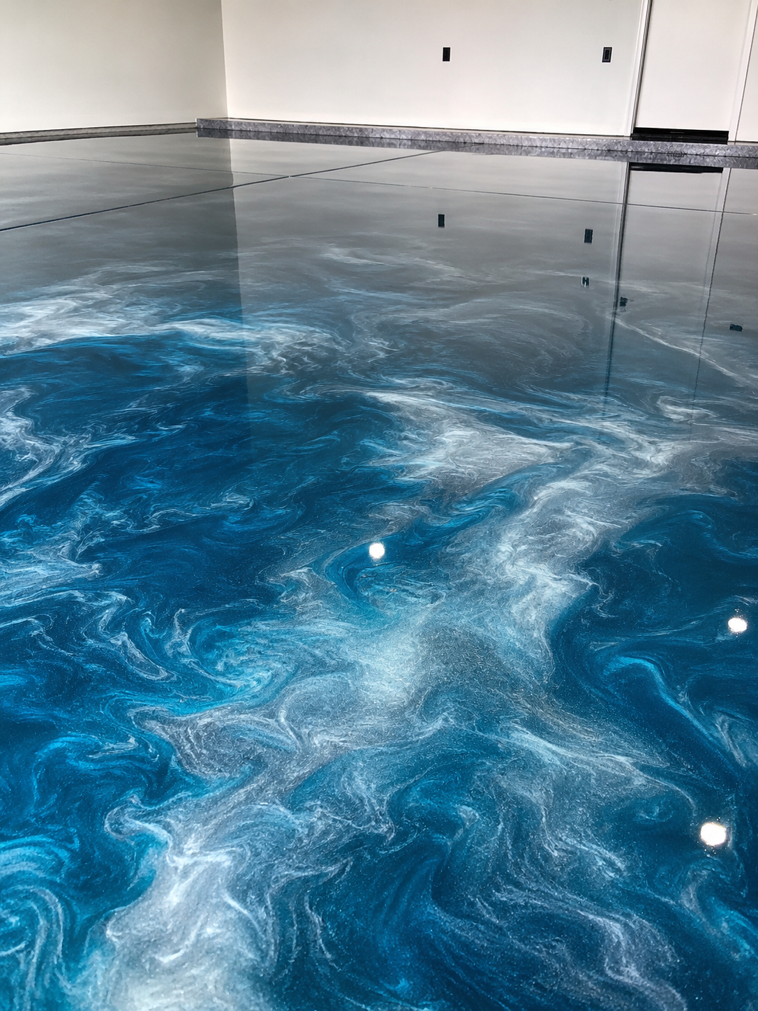 Finished metallic epoxy floor coating installed by EPOXY Flooring by NovaRiver LLC in Dallas TX